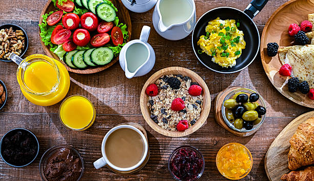 istock Breakfast served with coffee, eggs, cereals and croissants 2243763392