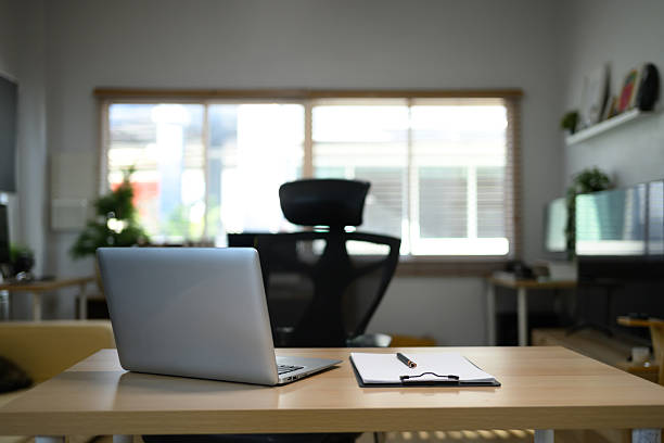 istock Modern workplace with laptop computer, coffee cup and office supplies 2243763417