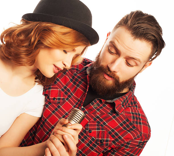 istock Lovely couple with microphone 2243763537