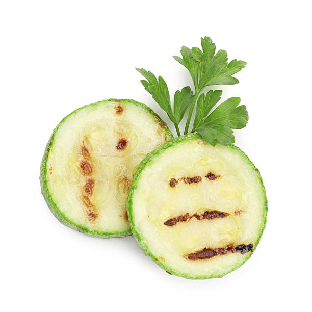 istock Delicious grilled courgette slices with parsley isolated on white, top view 2243763865