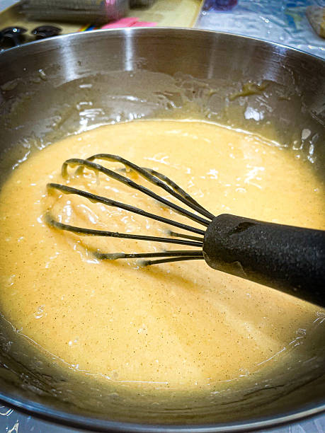 istock Mixing cake dough with whisk in stainless bowl 2243764704