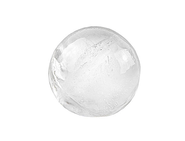 istock A round-shaped ice cube for a drink isolated on white background. 2243764722