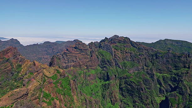istock Aerial landscape high rocky cliffs covered vivid vegetation. Drone view Madeira 2243769580