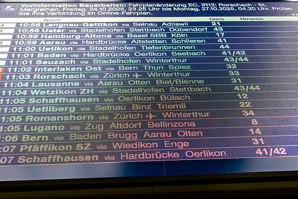 Amstelveen, The Netherlands. December 13th, 2024: Close-up of an R-NET tram stop information display in Amstelveen. The digital board shows the departure times for tram line 25 heading to Uithoorn Centrum and Station Zuid, while a red analog clock provides the current time. The sleek design of the stop reflects modern public transportation infrastructure.