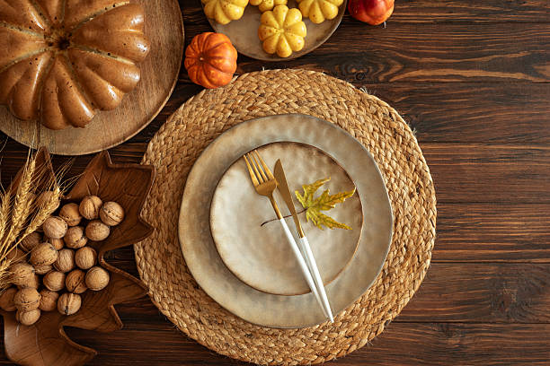 istock Festive Autumn Table Setting with Ceramic Plates, Pumpkins, Cake and Rustic Decor 2243770249