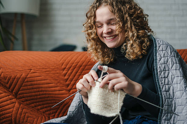 istock Relaxed female creating handmade garments in cozy living space 2243773298