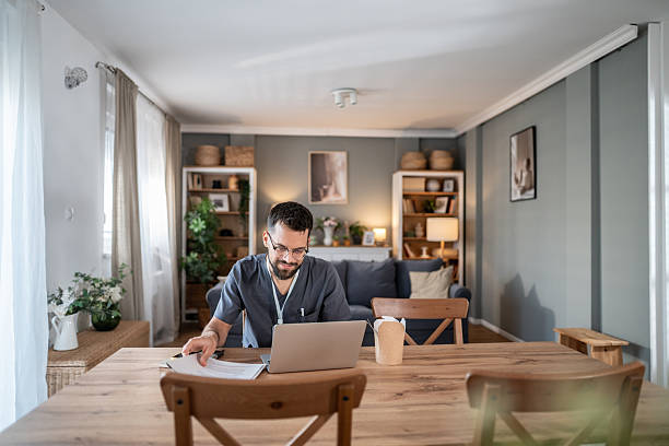 istock Doctor working remotely from home discussing telehealth 2243774444