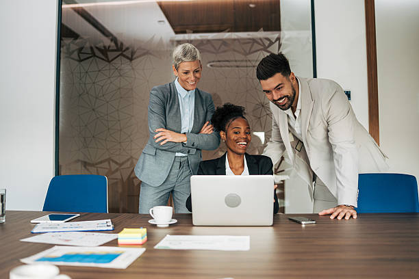 istock Business colleagues collaborating on laptop in office meeting 2243774932