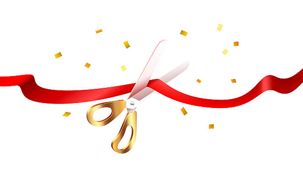 istock Grand Opening Ceremony. Golden scissors cut a red ribbon with festive confetti. 2243779232