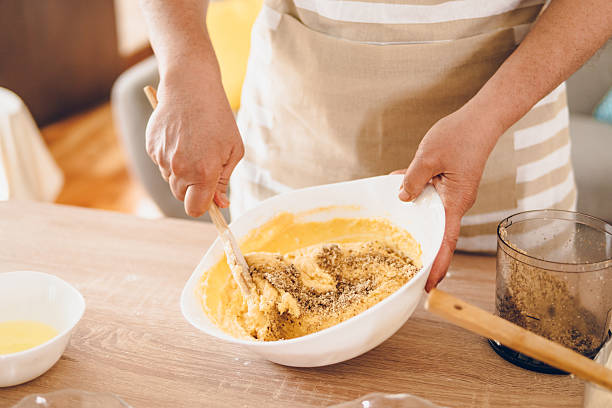 istock A woman whips cream for cakes 2243780474