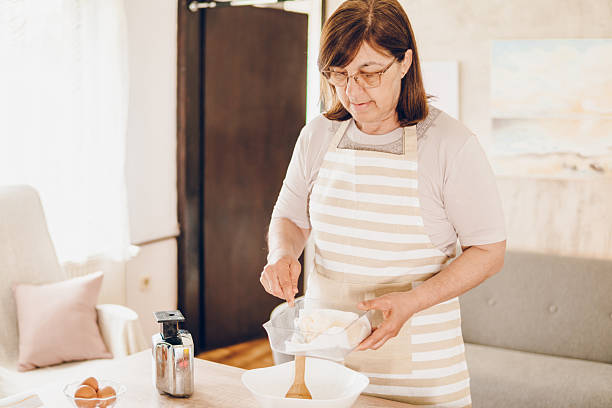 istock A woman whips cream for cakes 2243781218
