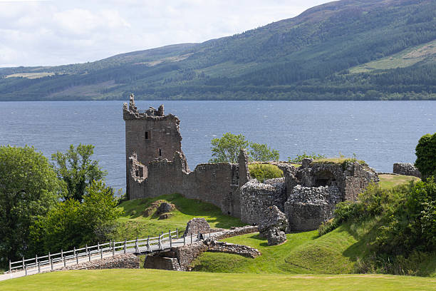 istock Urquhart Castle by a lake 2243781369