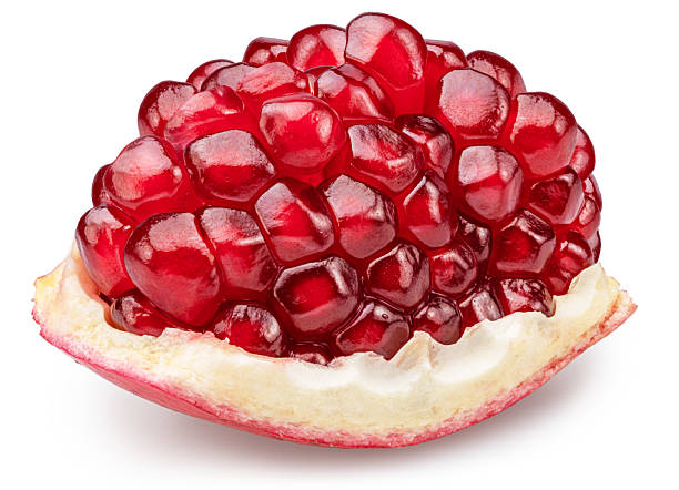 istock Pomegranate piece with pomegranate seeds isolated on a white background. Clipping path. Stacking focus, maximum detail. 2243782248