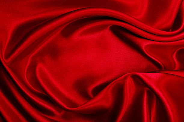 istock Smooth elegant red silk or satin luxury cloth texture as abstract background. Luxurious valentines day background design 2243784166