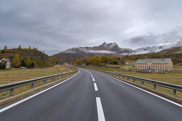 Simplon Pass, Canton Wallis, Switzerland - October 21, 2025: Autumn on the Simplon Pass with Monte-Leone Hotel, the Simplon Hospice behind, Simplon, Valais, Switzerland