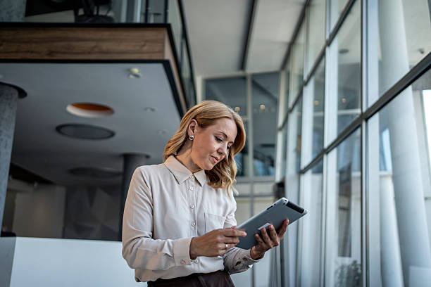 istock Businesswoman using digital tablet focusing on technology in modern office 2243785342