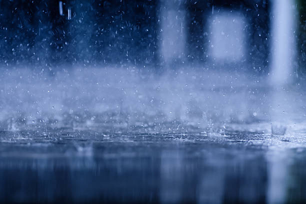 istock heavy raining make many small splash crown from water droplets drop down to the concrete floor in blue tone color scene 2243785856