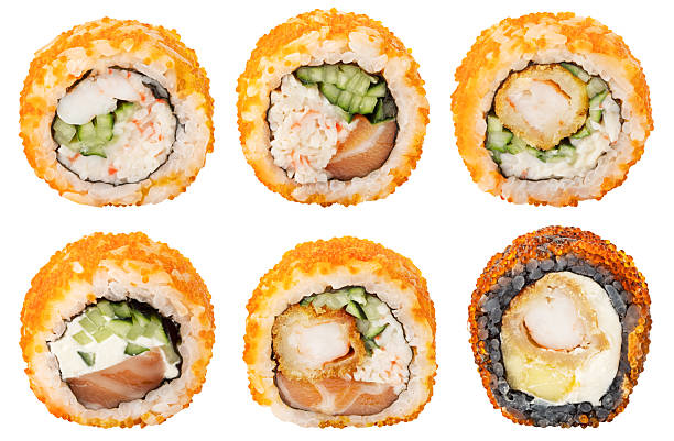 istock Collection of different sushi rolls. California maki type rolls (cheese, crab meat, cucumber, avocado, shrimp, nori, tobiko roe) isolated on white background 2243786621