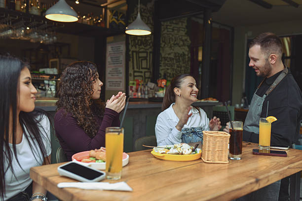 istock Friends And Client Enjoy Breakfast At Modern Lounge Bar and Having Fun 2243791718