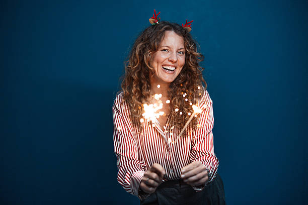 istock Group enjoying festive night with sparkling lights 2243792225
