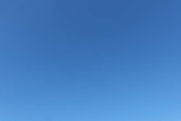istock Clear blue sky background – minimalist natural backdrop for design and photography 2243794584