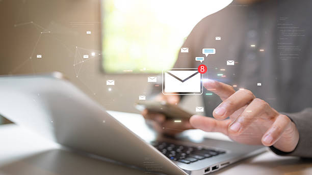 istock A person using a smartphone and laptop to check new email notifications, symbolizing digital communication and online connectivity. 2243797583