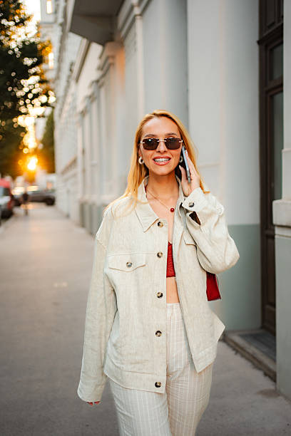 istock Woman talking on phone walking in Vienna street 2243797607
