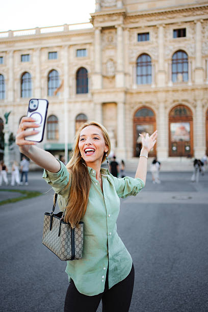 istock Happy young woman taking selfie in Vienna 2243799584
