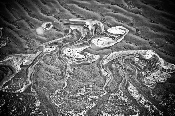 Wet beach sand with natural grooves in Stoke Gabriel Devon England UK