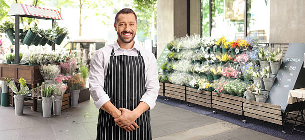 istock Male shop assistant with an apron 2243806044