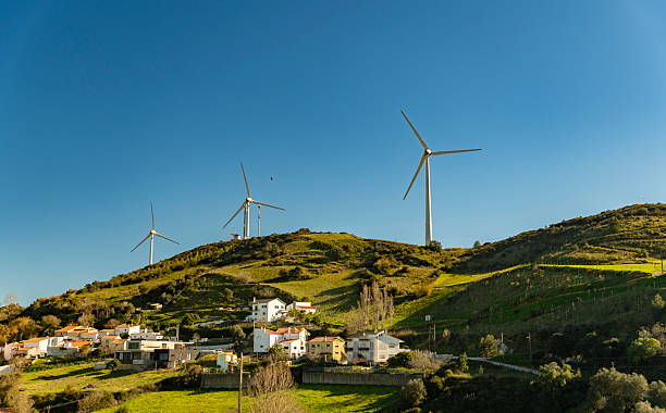 Wind turbines in the mist. Wind farm in Navarre, Spain. Renewable energy concept. View on the top.