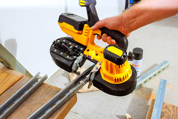 istock Handheld power tool for precise cutting of metal rails in workshop setting 2243813353