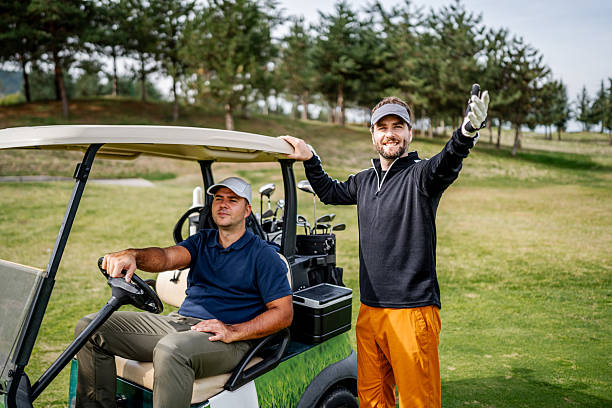 istock Friends playing golf with cart on course 2243814302