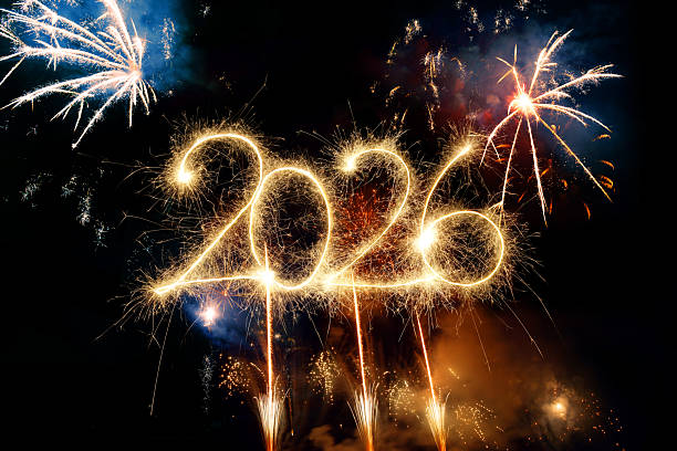istock Sparkler Happy New Year 2026 with fireworks 2243814354