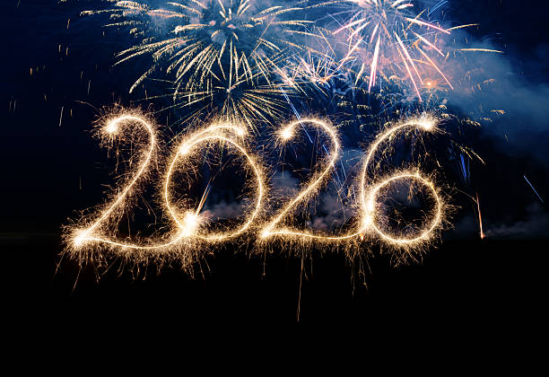 istock Sparkler Happy New Year 2026 with fireworks 2243814443