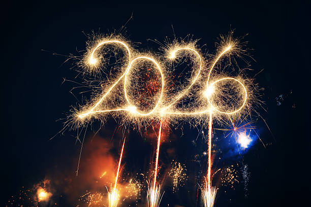 istock Sparkler Happy New Year 2026 with fireworks 2243814785
