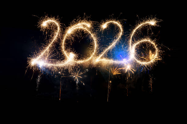 istock Sparkler Happy New Year 2026 with fireworks 2243814901