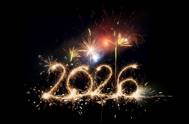 istock Sparkler Happy New Year 2026 with fireworks 2243815002