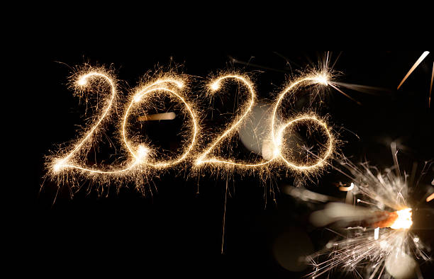 istock Sparkler Happy New Year 2026 with fireworks 2243815031
