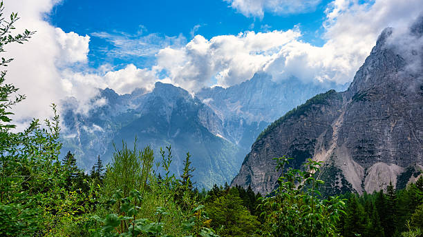 Cloud-covered mountain peaks at dawn on a summer's day, Vrsic Pass, Slovenia