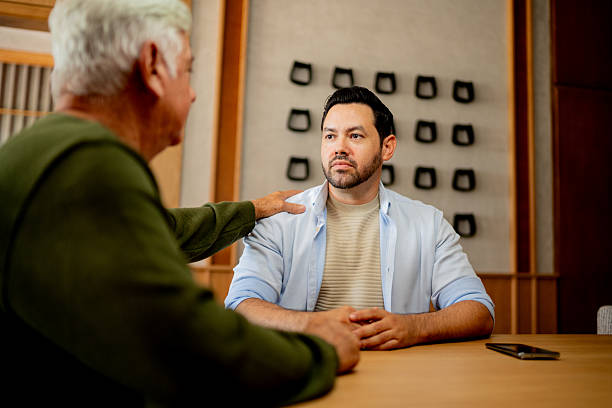 istock Father consoling son at home 2243815344