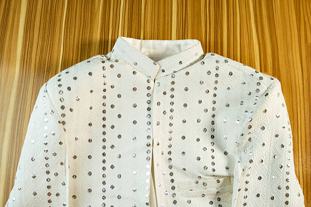 A studio shot of a stylish pink textured tweed jacket designed for women, featuring a fitted silhouette, long sleeves, front zip closure, and decorative pockets, isolated on a clean white background with copy space, suitable for fashion catalog, e commerce, retail, luxury clothing, and modern womenswear concepts