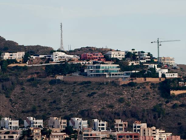 istock developing hillside villa communities, evolving residential area with cranes and scaffolding 2243818368