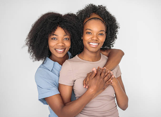 istock Affectionate mother and daughter portrait close to a white wall 2243818895