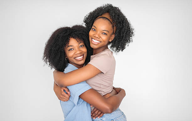 istock Affectionate mother and daughter portrait close to a white wall 2243818898