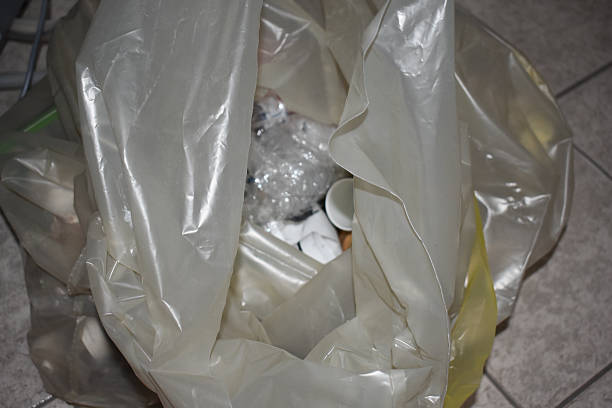 istock Construction garbage after apartment repair in a plastic bag. Cleaning after renovation work. Repair in the apartment. Home renovation, sustainable living, energy efficiency concept. 2243819056