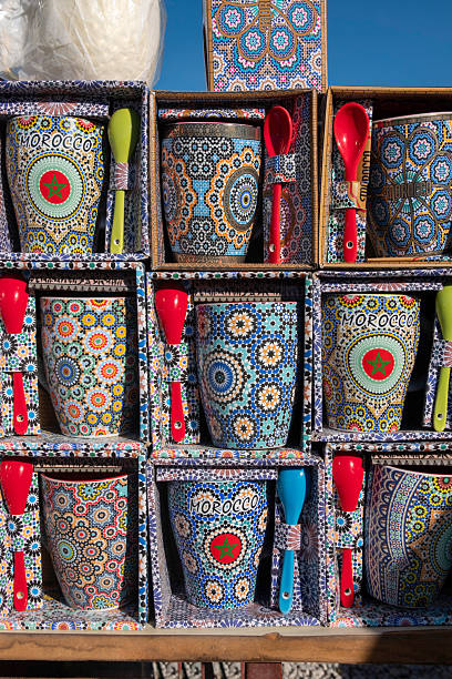 istock Ceramic mugs and spoons displayed for sale, featuring traditional Moroccan mosaic designs. 2243821110
