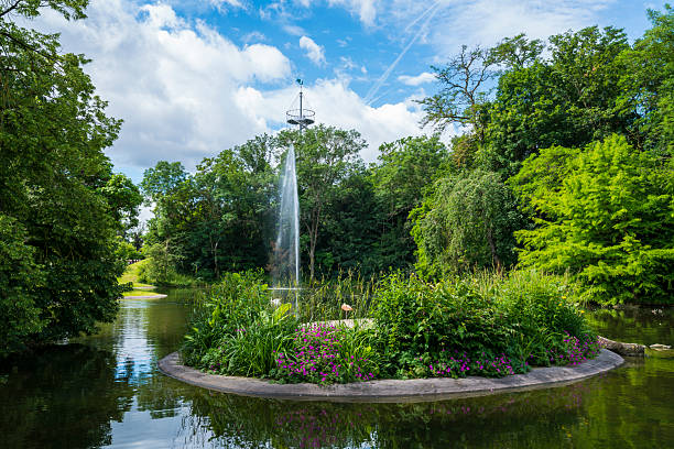 Germany, Killesbergpark public park in stuttgart killesberg district green nature landscape, water fountain and lookout tower in summer