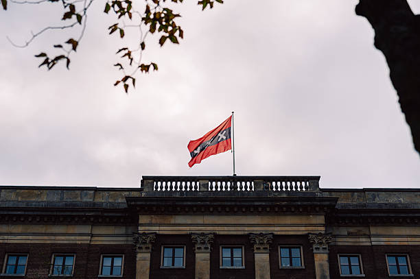 istock Amsterdam flag waving on historic building facade 2243823785