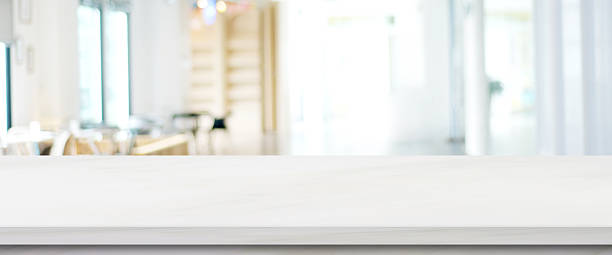 istock Empty white marble table over blur office background, Stone desk for product display mock up template banner, white background 2243823875